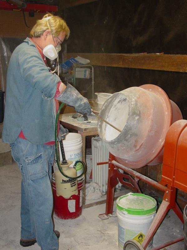 spraying water into glass batch