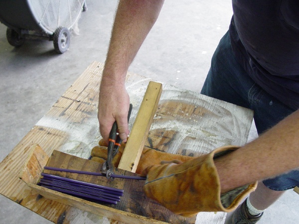 Cutting glass furnace bead glass cane smaller to fit kiln/annealer